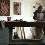 Richard Knox working on top of his sculpture bench
